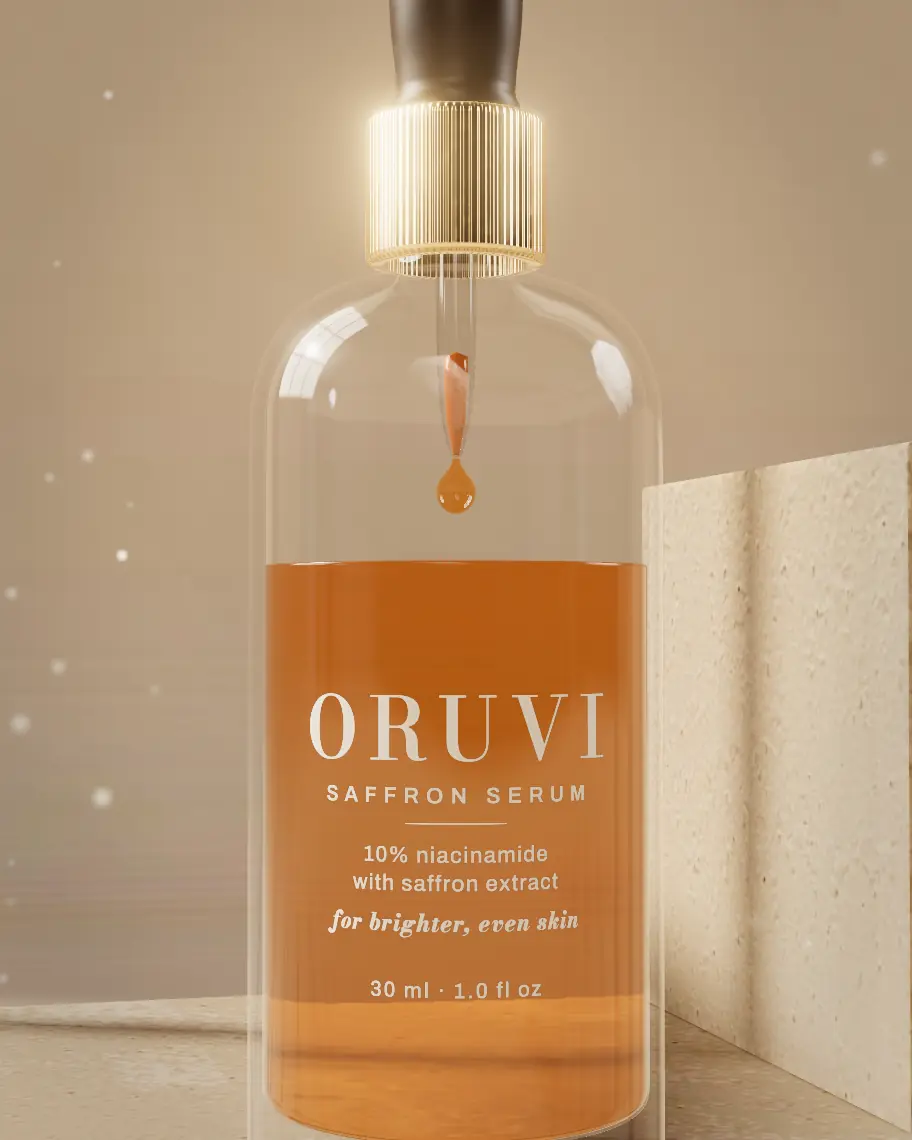 Close up of the print on the glass: ORUVI, saffron serum, 10% niacinamide with saffron extract